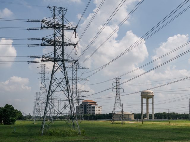 HOUSTON, TEXAS - JUNE 15: Power-lines are shown on June 15, 2021 in Houston, Texas. The Electric Reliability Council of Texas (ERCOT), which controls approximately 90% of the power in Texas, has requested Texas residents to conserve power through Friday as temperatures surge in the state. An increase in forced …