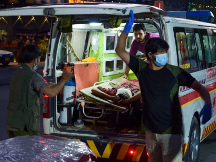 EDITORS NOTE: Graphic content / Medical staff bring an injured man to a hospital in an amb