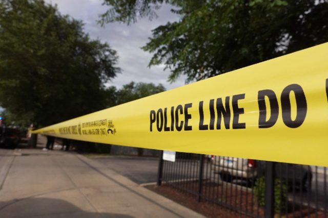 Police tape surrounds a crime scene in a Chicago neighborhood