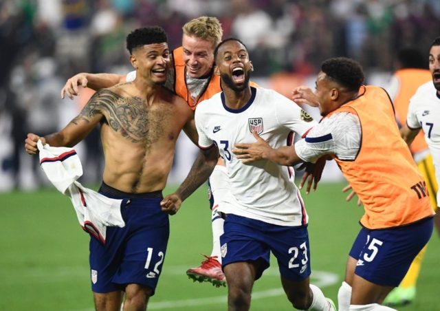 USA's Miles Robinson (left) celebrates winning the CONCACAF Gold Cup final with a 1-0 vict