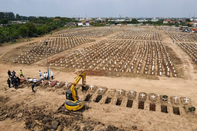The graves of Covid-19 victims at a cemetery in Jakarta
