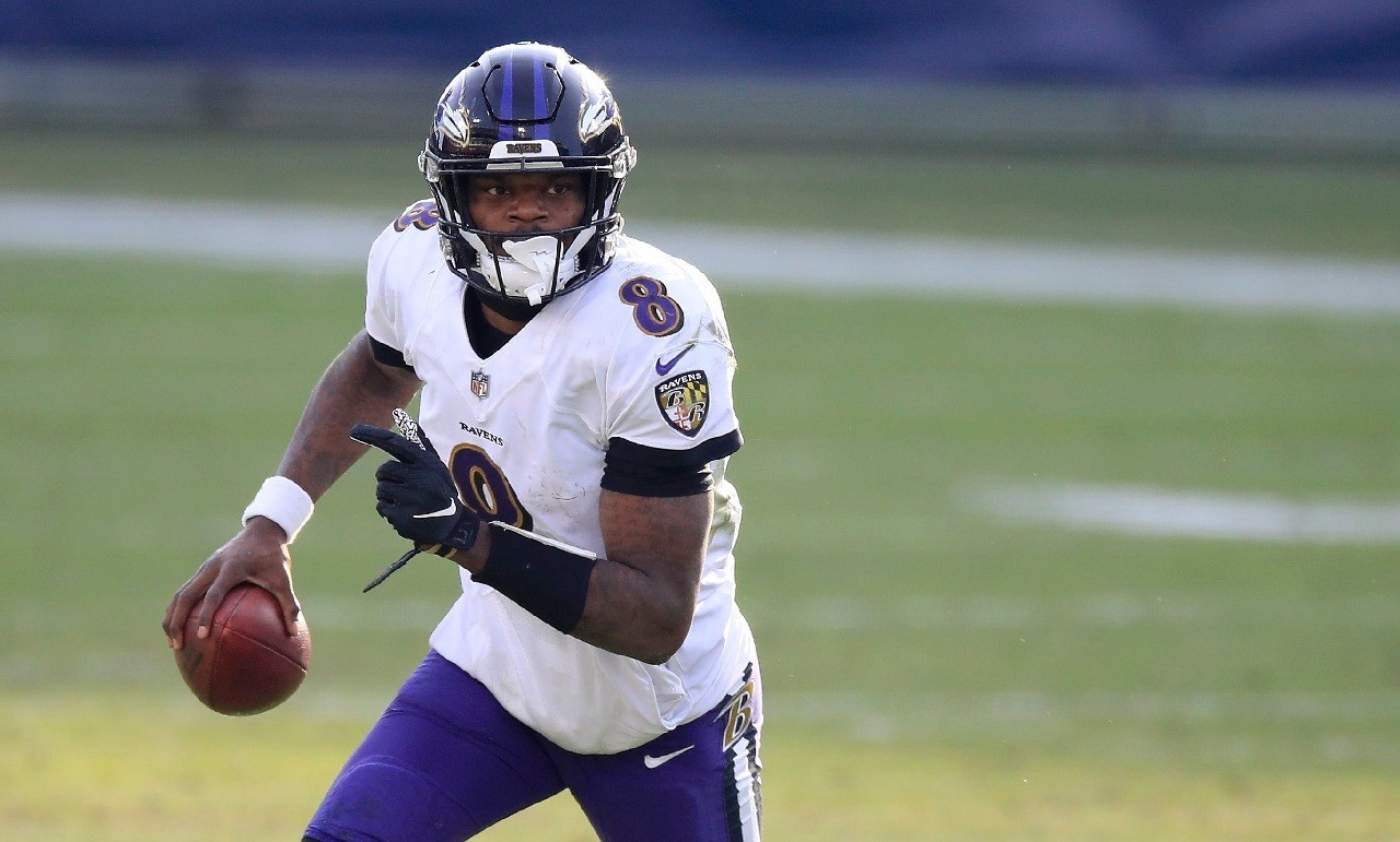 Baltimore Ravens quarterback Lamar Jackson, back with the NFL club after a ...