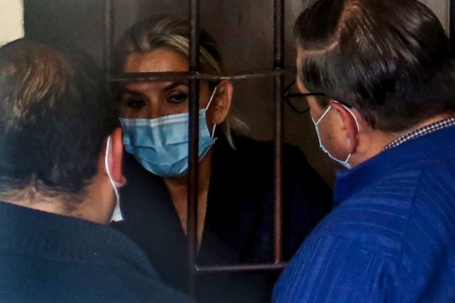 Former interim Bolivian president Jeanine Anez speaks with her lawyers in March 2021 from