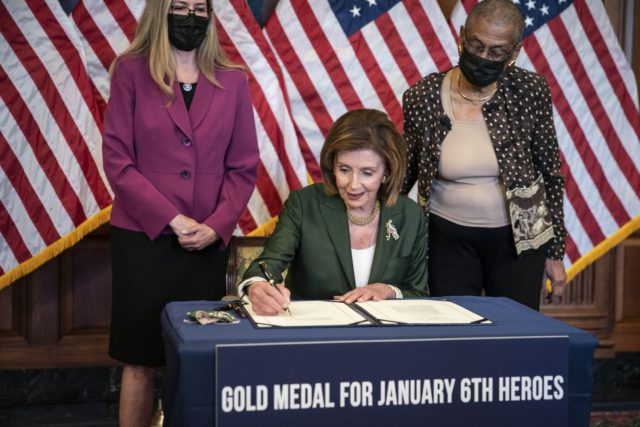 Pelosi signs bill giving Congressional Gold Medal to officers in Capitol riots