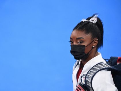 USA's Simone Biles looks on during the artistic gymnastics women's team final during the Tokyo 2020 Olympic Games at the Ariake Gymnastics Centre in Tokyo on July 27, 2021. (Photo by Martin BUREAU / AFP) (Photo by MARTIN BUREAU/AFP via Getty Images)