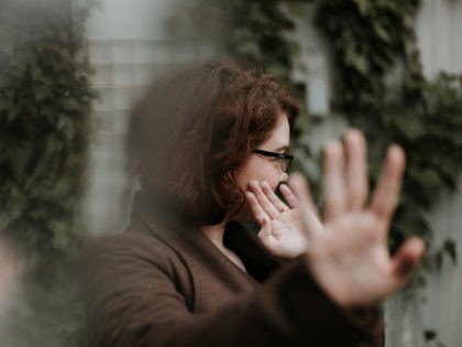 Woman gesturing no and looking away (Unsplash/ Priscilla Du Preez)
