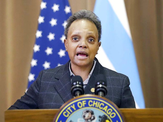 Chicago mayor Lori E. Lightfoot, left, speaks Thursday, Feb. 11, 2021, during a news conference at the William H. Brown Elementary School after a tour of the school. In-person learning for students in pre-k and cluster programs began Thursday, since the district's agreement with Chicago Teachers Union was reached. (AP …