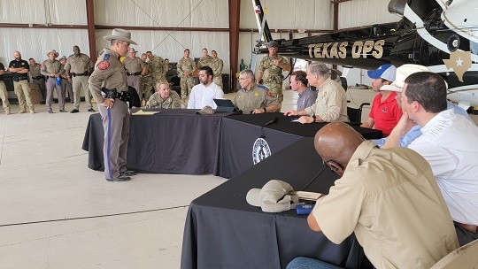 Texas Department of Public Safety Southern Region Director Victor Escalon, Director Steve McCraw, Texas National Guard Adjutant General Tracy Norris, and National Border Patrol Council President Brandon Judd brief Texas Governor Greg Abbott, House Speaker Dade Phelan and a delegation of state representatives on the current conditions in Del Rio. (Photo: Bob Price/Breitbart Texas)