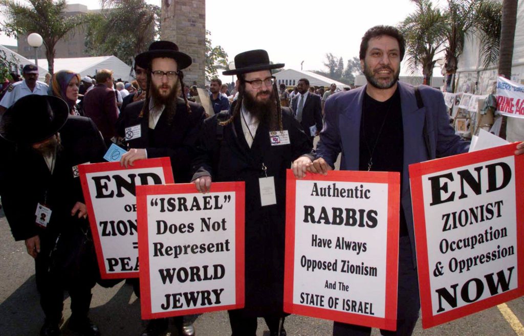 Jews demonstrate at an non-governmental organization protest rally against Israel ahead of the upcoming conference against racism in Durban, South Africa Wednesday, Aug. 29, 2001. The UN meeting, which runs through Sept. 7, was planned as a gathering for world leaders, academics and private organizations to discuss issues of intolerance and ways to combat them. However, it has already been marked by controversy over efforts to equate Zionism with racism and demands for Western governments to pay reparations for slavery and colonialism. (AP Photo/Themba Hadebe)
