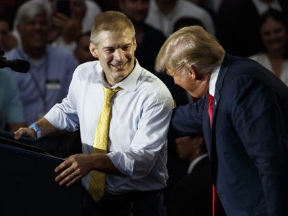 Rep. Jim Jordan, R-Ohio, looks to President Donald Trump as he speaks at a rally at Olenta