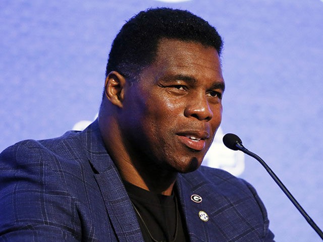 Herschel Walker talks about 150 years of college football during the NCAA college football Southeastern Conference Media Days, Tuesday, July 16, 2019, in Hoover, Ala. (AP Photo/Butch Dill)