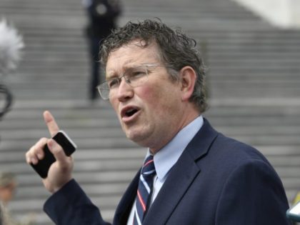 FILE - In this March 27, 2020 file photo Rep. Thomas Massie, R-Ky., talks to reporters before leaving Capitol Hill in Washington. Massie, a Kentucky congressman said Kyle Rittenhouse charged with fatally shooting two people with a semi-automatic rifle during the unrest in Wisconsin showed “incredible restraint" and acted in …