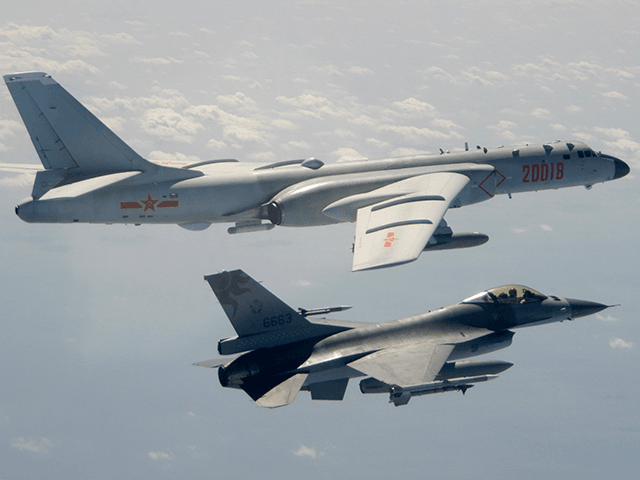 In this Feb. 10, 2020, file photo and released by the Republic of China (ROC) Ministry of National Defense, a Taiwanese Air Force F-16 in foreground flies on the flank of a Chinese People's Liberation Army Air Force (PLAAF) H-6 bomber as it passes near Taiwan. This year's annual congress …