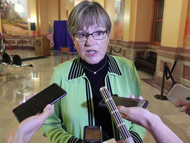 Kansas Gov. Laura Kelly answers questions from reporters following an event at the Statehouse, Thursday, July 22, 2021, in Topeka, Kan. Kelly says getting more Kansas residents vaccinated is the only way to stop the spread of the COVID-19 delta variant. (AP Photo/John Hanna)