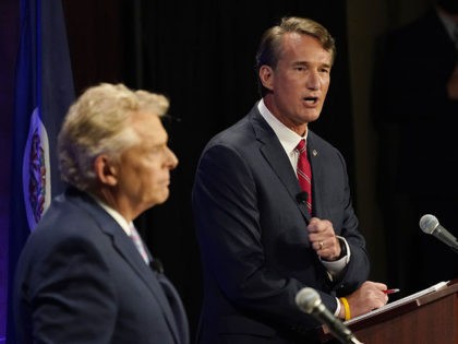 Republican gubernatorial candidate Glenn Youngkin, right, gestures as Democratic gubernatorial candidate and former governor Terry McAuliffe, left, looks on during a debate at the Appalachian School of Law in Grundy, Va., Thursday, Sept. 16, 2021. (AP Photo/Steve Helber)