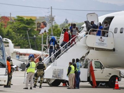 Haitians who were deported from the United States deplane at the Toussaint Louverture International Airport, in Port au Prince, Haiti, Sunday, Sep. 19, 2021. Thousands of Haitian migrants have been arriving to Del Rio, Texas, to ask for asylum in the U.S., as authorities begin to deported them to back …
