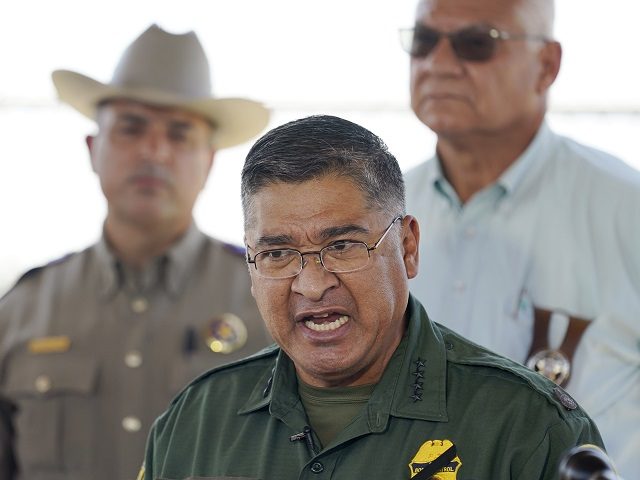 Border Patrol Chief Raul L. Ortiz speaks to the media near the International Bridge where thousands of Haitian migrants have formed a makeshift camp, Sunday, Sept. 19, 2021, in Del Rio, Texas. Ortiz said that 3,300 migrants have already been removed from the Del Rio camp to planes or detention …