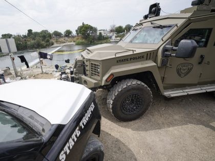 Texas Department of Safety vehicles are seen along the Rio Grande, Tuesday, Sept. 21, 2021, in Del Rio, Texas. The U.S. is flying Haitians camped in a Texas border town back to their homeland and blocking others from crossing the border from Mexico. (AP Photo/Julio Cortez)