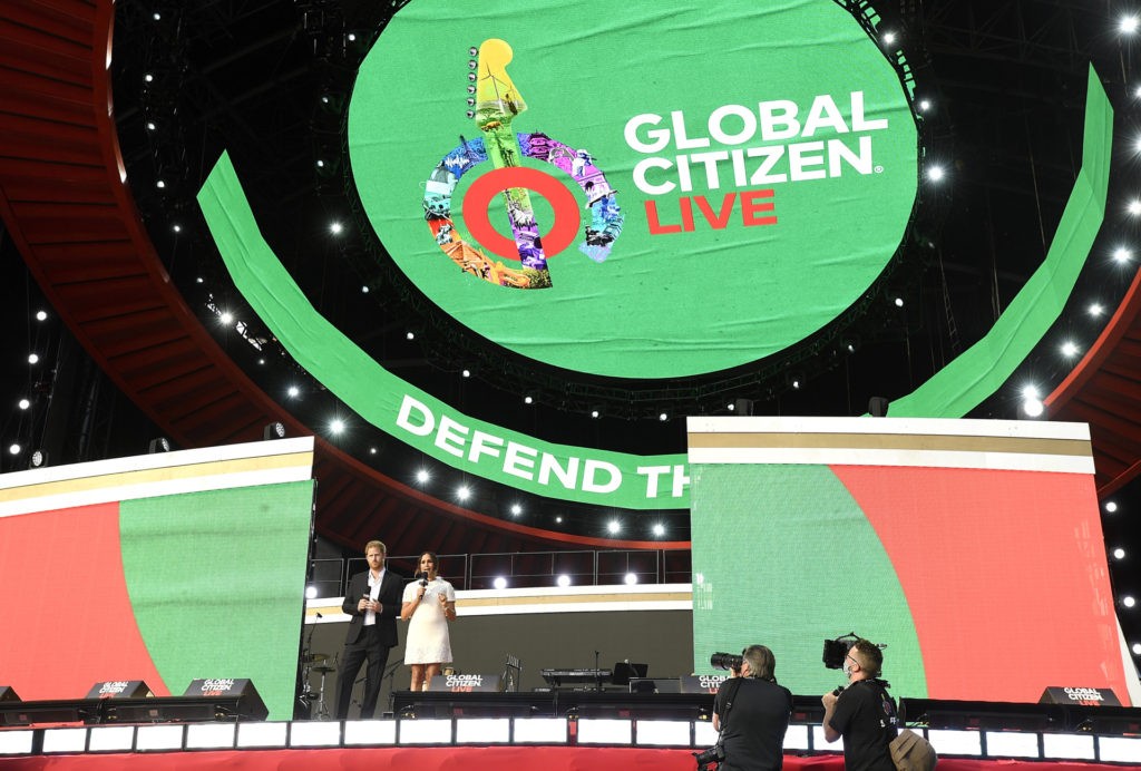 Prince Harry, the Duke of Sussex, left, and Meghan, the Duchess of Sussex speak at Global Citizen Live in Central Park on Saturday, Sept. 25, 2021, in New York. (Photo by Evan Agostini/Invision/AP)