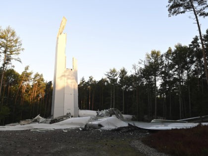 Remains of the tower of a wind turbine stand in the forest in Haltern, Germany, Thursday, Sept.30, 2021. The wind turbine, which is almost 240 metres high, has collapsed. (Guido Bludau/dpa via AP)