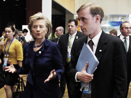 FILE - This Nov. 11, 2009 file photo shows then-Secretary of State Hillary Rodham Clinton walking with a then-Deputy Chief of Staff Jake Sullivan in Singapore. Last summer, Sullivan was traveling with his boss, Hillary Rodham Clinton, when he suddenly disappeared during a stop in Paris. He showed up again …