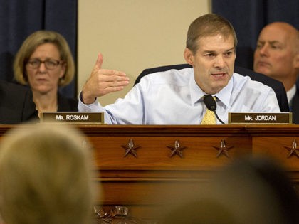 Rep. Jim Jordan, R-Ohio, right, asks a question of Democratic presidential candidate and former Secretary of State Hillary Rodham Clinton, during a hearing on Capitol Hill in Washington, Thursday, Oct. 22, 2015, before the House Select Committee on Benghazi. At left is Rep. Peter Roskam, R-Ill. (AP Photo/Jacquelyn Martin)