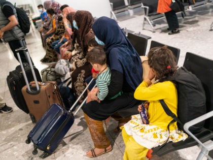 LONDON, ENGLAND - AUGUST 26: Refugees from Afghanistan wait to be processed after arriving on a evacuation flight at Heathrow Airport on August 26, 2021 in London, England. Ministry of Defence figures put the number of people evacuated by the UK since August 13 at 9,226, but there are thousands …