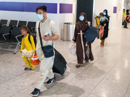 LONDON, ENGLAND - AUGUST 26: Refugees from Afghanistan arrive on a evacuation flight at Heathrow Airport on August 26, 2021 in London, England. Ministry of Defence figures put the number of people evacuated by the UK since August 13 at 9,226, but there are thousands feared to be remaining. Foreign …