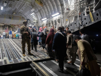 In this Aug. 22, 2021, file photo provided by the U.S. Air Force, Afghan passengers board