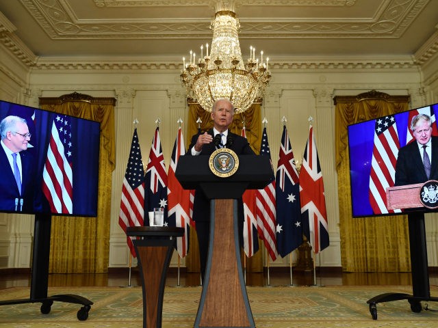 US President Joe Biden participates is a virtual press conference on national security with British Prime Minister Boris Johnson (R) and Australian Prime Minister Scott Morrison in the East Room of the White House in Washington, DC, on September 15, 2021. (Photo by Brendan Smialowski / AFP) (Photo by BRENDAN …