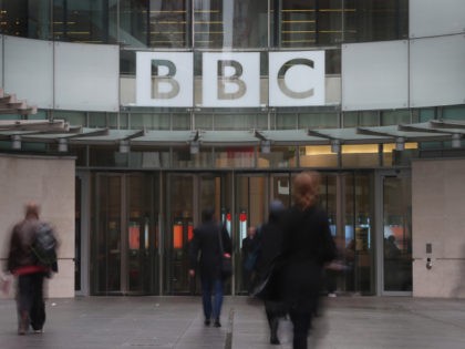LONDON, UNITED KINGDOM - OCTOBER 22: People walk near the entrance to BBC Broadcasting Hou