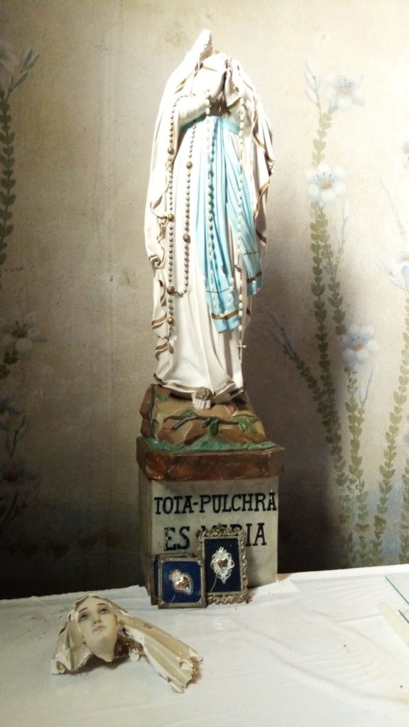 Beheaded statue of Virgin Mary