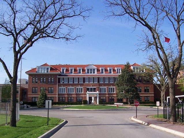This picture of St. Joseph Hall, a building of Benet Academy, was taken from the driveway leading to the school, May 2008, Lisle, Illinois. (Benny the Mascot/Wikimedia Commons)
