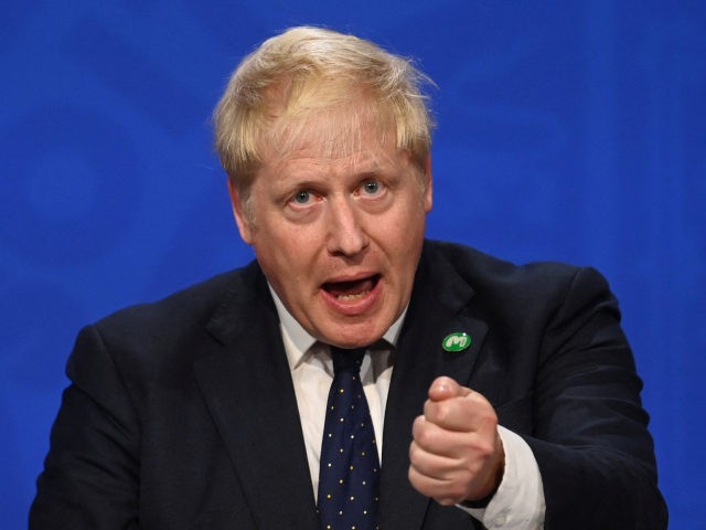 Britain's Prime Minister Boris Johnson speaks during a press conference inside the Downing