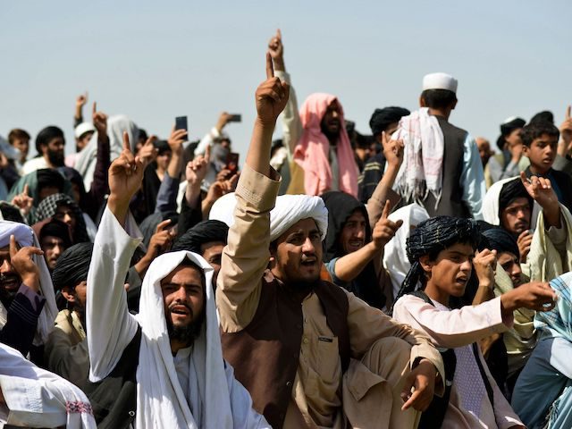 TOPSHOT - Taliban supporters gather to celebrate the US withdrawal of all its troops out of Afghanistan, in Kandahar on September 1, 2021 following the Talibans military takeover of the country. (Photo by JAVED TANVEER / AFP) (Photo by JAVED TANVEER/AFP via Getty Images)