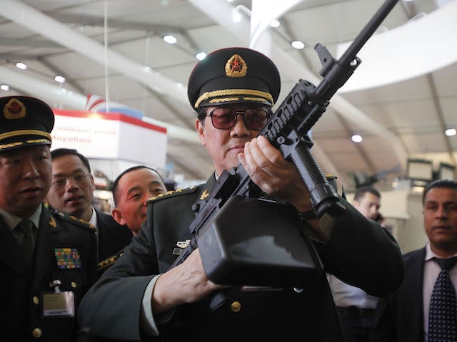 Chinese officers check on rifles of ARES Defense Systems, Inc from the U.S. during the ope