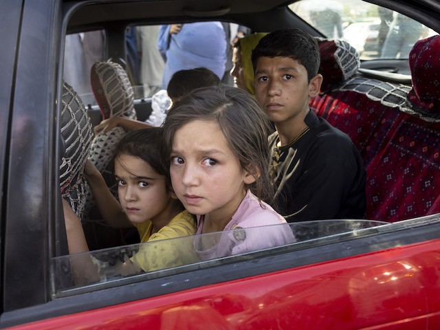 Displaced Afghan families move into Kabul from the northern provinces, desperately abandoning their homes in Kabul, Afghanistan, on Aug. 10, 2021. (Paula Bronstein/Getty Images)