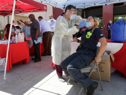 n this Aug. 6, 2020, file photo, Hialeah Fire Department Firefighter-Paramedic Laura Nemog