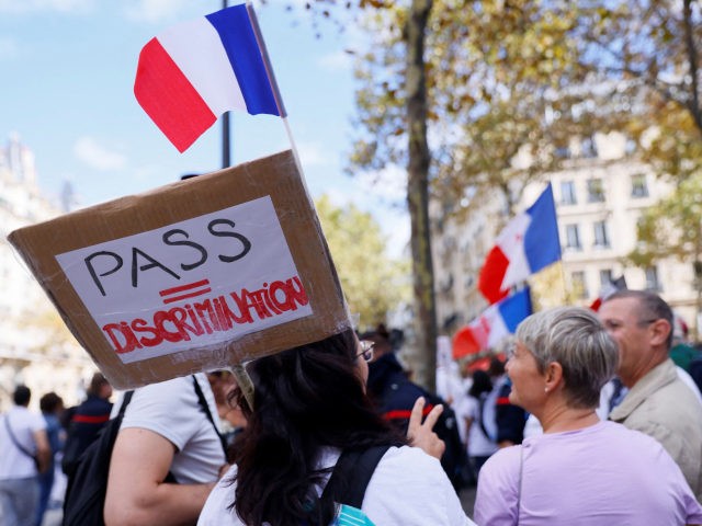 Medical staff members demonstrate against the compulsory Covid-19 vaccination for certain workers, and the mandatory use of the health pass called by the French government to access most public spaces, in front of the Health Ministry in Paris on September 11, 2021. - France began enforcing on August 9, 2021, …