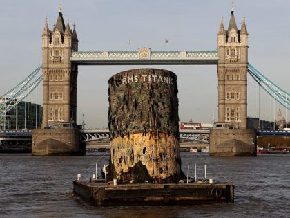 LONDON, ENGLAND - NOVEMBER 03: A replica of the upper section of the fourth funnel of the Titanic is towed along the river Thames towards Tower Bridge on November 3, 2010 in London, England. The replica funnel has been created to launch a new exhibition of artefacts recovered from the …