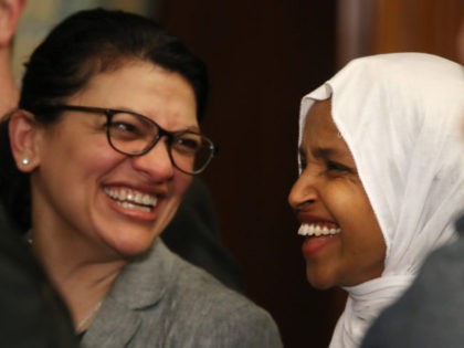 WASHINGTON, DC - MARCH 13: Rep. Ilhan Omar (D-MN) (R) and Rep. Rashida Tlaib (D-MN) attend a news conference where House and Senate Democrats introduced the Equality Act of 2019 which would ban discrimination against lesbian, gay, bisexual and transgender people, on March 13, 2019 in Washington, DC. (Photo by …