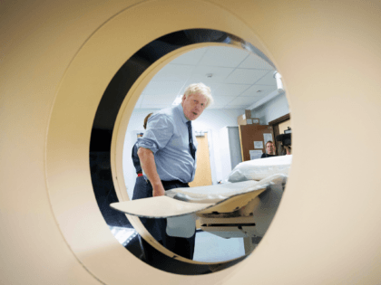 HARLOW, ENGLAND - SEPTEMBER 27: Prime Minister Boris Johnson meets staff and sees an MRI CT Scanner during a visit to the Princess Alexandra hospital for an announcement on new patient scanning equipment on September 27, 2019 in Harlow, United Kingdom. The Prime Minister is pledging an overhaul to cancer …