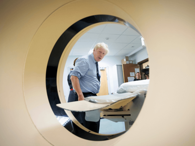 HARLOW, ENGLAND - SEPTEMBER 27: Prime Minister Boris Johnson meets staff and sees an MRI C