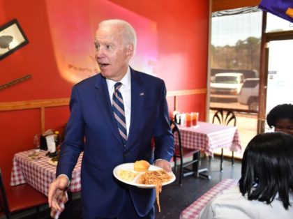 Democratic presidential candidate Joe Biden picks up some lunch at Pearl's Southern Cooking restaurant in Jackson, Mississippi on March 8, 2020. (Photo by MANDEL NGAN / AFP) (Photo by MANDEL NGAN/AFP via Getty Images)