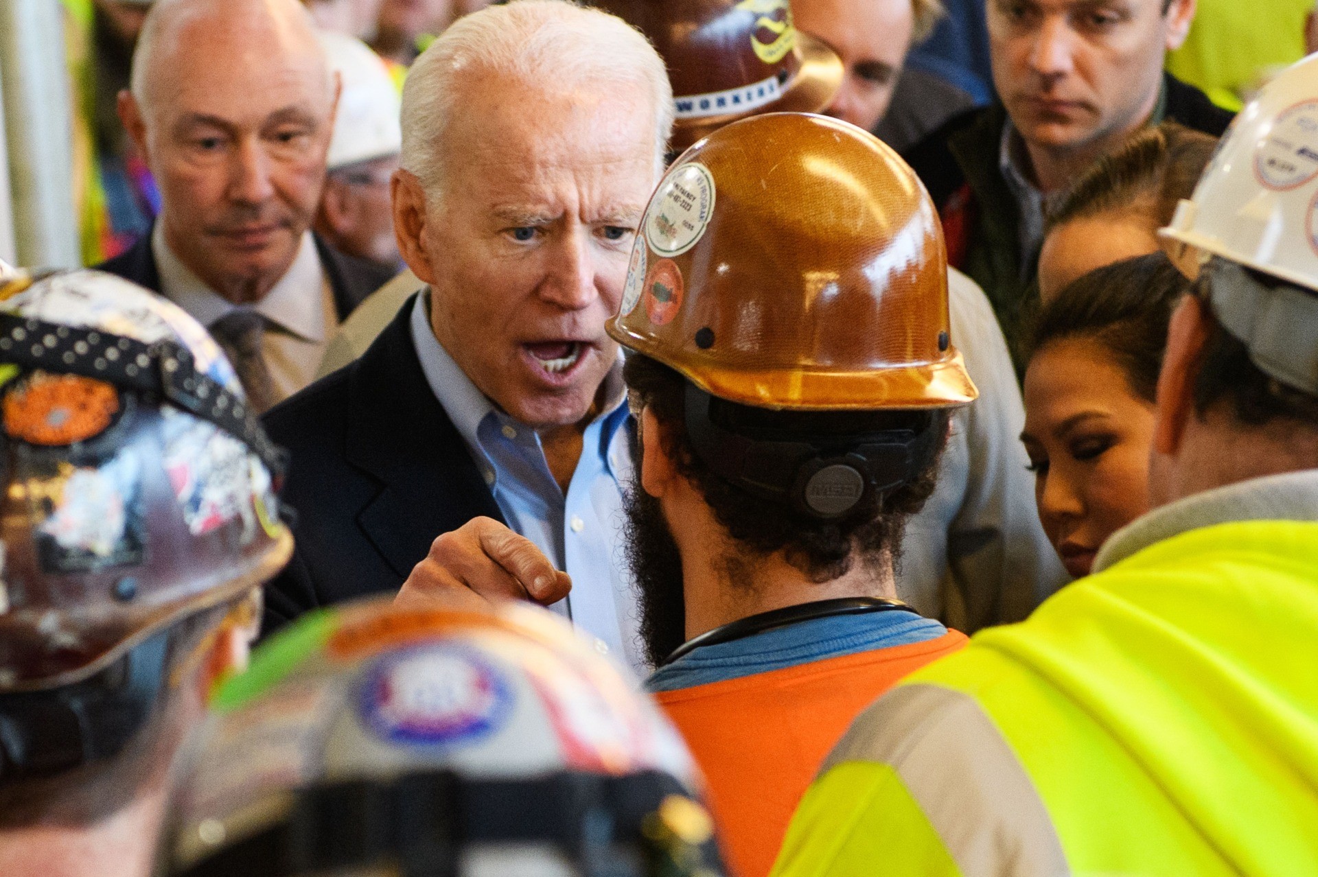 TOPSHOT - Democratic presidential candidate Joe Biden has heated exchange meets workers and discusses gun rights as he tours the Fiat Chrysler plant in Detroit, Michigan on March 10, 2020. - Biden opened primary day meeting workers at an under-construction automobile plant in Detroit, where he received cheers but also was confronted by one worker. In an exchange avidly shared online by Trump supporters, the worker, wearing a construction helmet and reflective vest, accused Biden of seeking to weaken the constitutional right to own firearms. "You're full of shit," Biden shot back. "I support the Second Amendment." When the worker pressed the issue, Biden, visibly agitated and with a raised voice, said "I'm not taking your gun away," adding, "Gimme a break, man." (Photo by MANDEL NGAN / AFP) (Photo by MANDEL NGAN/AFP via Getty Images)