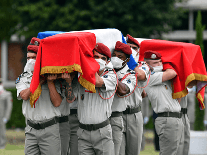 The coffins of two French soldiers with the anti-jihadist Barkhane force in Mali killed when their armoured vehicle hit an improvised explosive device, are carryed by fellow soldiers during a national tribute ceremony in Tarbes on September 9, 2020. (Photo by Laurent DARD / AFP) (Photo by LAURENT DARD/AFP via …