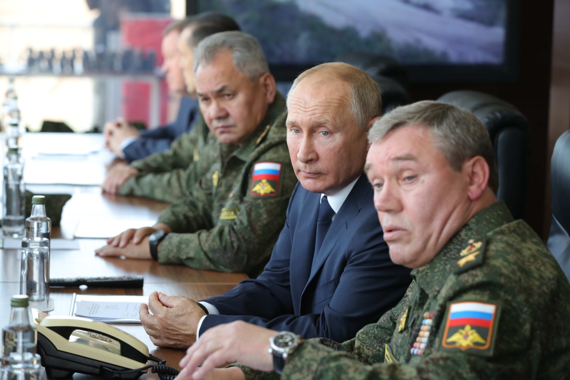 Russian President Vladimir Putin, accompanied by Defence Minister Sergei Shoigu and Valery Gerasimov, the chief of the Russian General Staff, oversees the "Caucasus-2020" military exercises at the Kapustin Yar range near the city of Astrakhan on September 25, 2020. (Photo by Mikhail KLIMENTYEV / SPUTNIK / AFP) (Photo by MIKHAIL KLIMENTYEV/SPUTNIK/AFP via Getty Images)