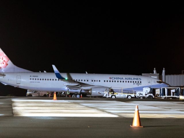 In this photo taken on April 1, 2021, a China Airlines Boeing 737-800 is seen at the airport in Koror following its flight transporting Taiwanese tourists, after Taiwan and Palau launched a rare holiday travel bubble to kickstart their battered tourist industries after successfully keeping Covid-19 infections at bay. (Photo …