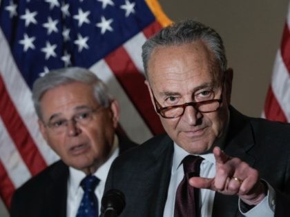 WASHINGTON, DC - MAY 18: (L-R) Sen. Bob Menendez (D-NJ) and Senate Majority Leader Chuck Schumer (D-NY) speak to reporters during a news conference following a policy luncheon meeting with fellow Senate Democrats on Capitol Hill May 18, 2021 in Washington, DC. Schumer and the Democratic Senators took questions form …