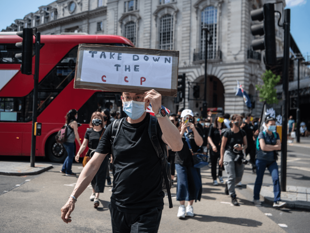 LONDON, ENGLAND - JUNE 12: Protesters attend a rally for democracy in Hong Kong on June 12, 2021 in London, England. The rally marked two years since a confrontation between Hong Kong police and protesters opposed to the Fugitive Offenders amendment bill, which was to provide a mechanism for extradition between Hong Kong and Mainland China. In the two years since, authorities in Hong Kong have criminalised dissent and sought to extinguish the pro-democracy movement. (Photo by Laurel Chor/Getty Images)